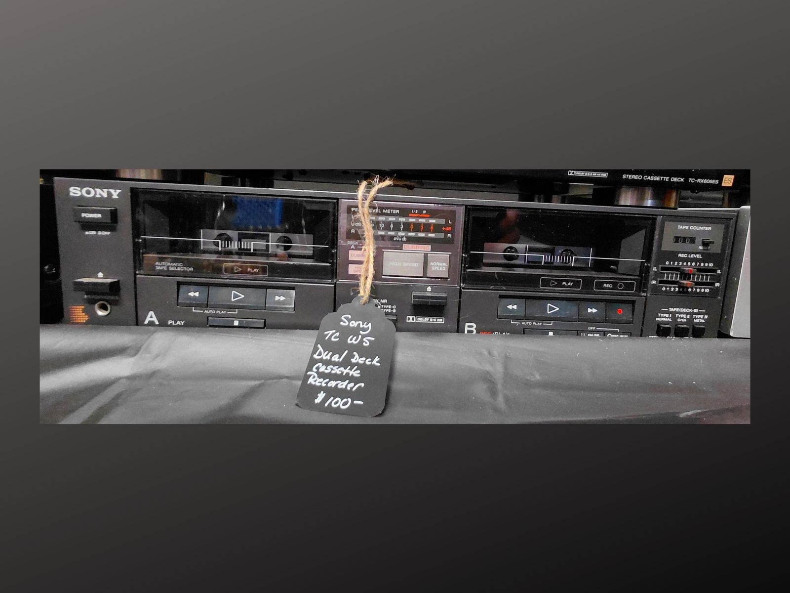 Sony TC-W5 dual cassette deck recorder front view with twin cassette wells and controls visible<br />
