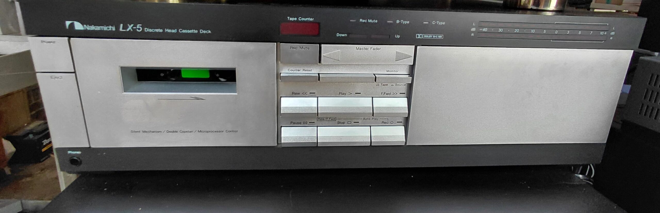 Nakamichi LX-5 discrete head cassette deck front panel showing transport controls, tape counter, and VU meters